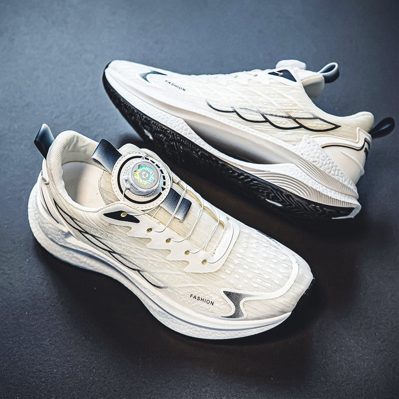 White sports sneakers with dial closure and black accents, lace-up strap