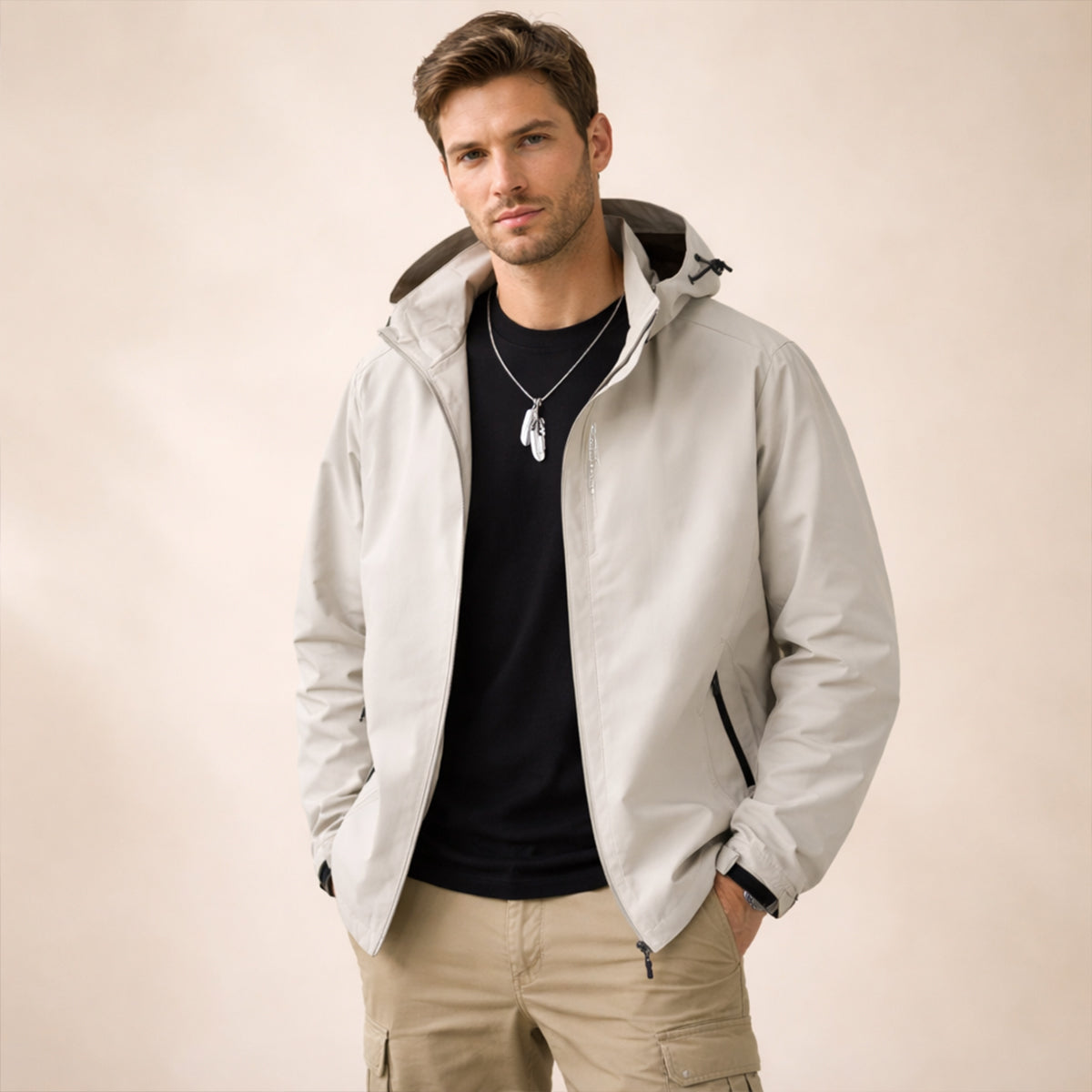 Light gray hooded rain jacket with front zip, adjustable hem, and side pockets