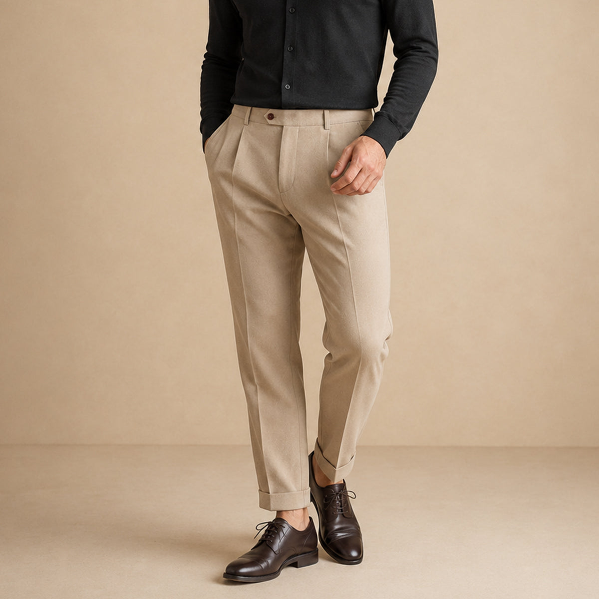 Men’s khaki classic-fit dress pants on model with pleats and belt loops