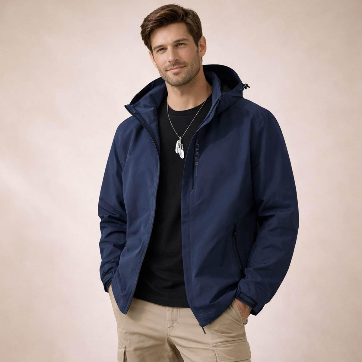 Navy hooded rain jacket with front zipper and pocket zippers