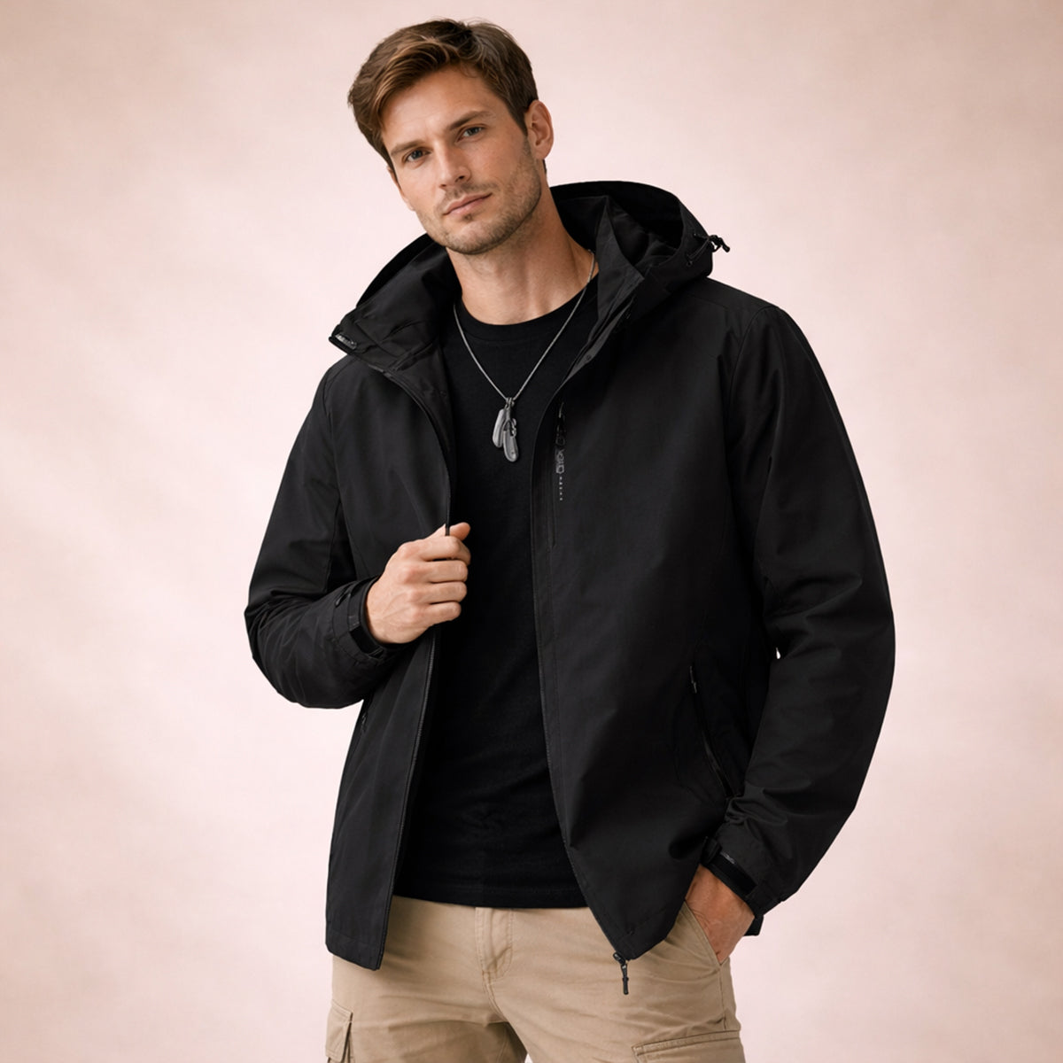 Black hooded rain jacket with adjustable hood and front zipper