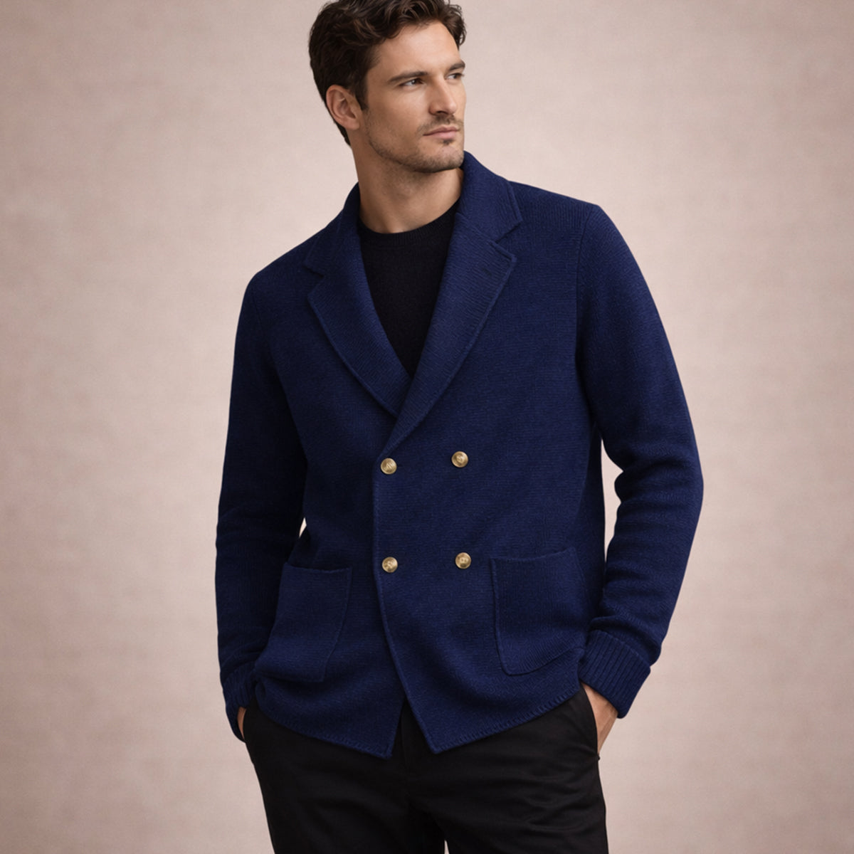 Men's navy blue double-breasted knit cardigan on model, with gold buttons and patch pockets