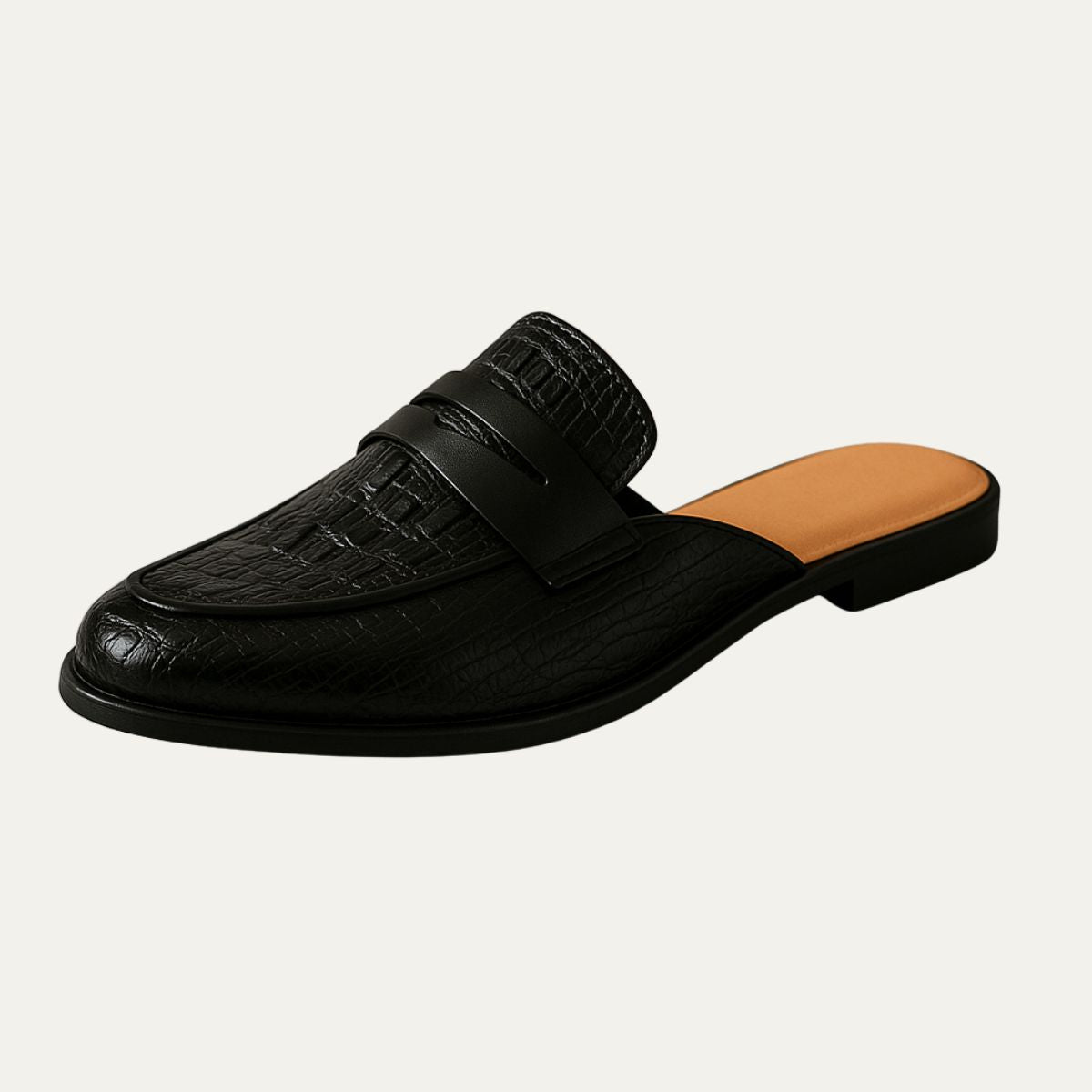 Black leather loafer mule with strap, embossed finish, and dark rubber sole.