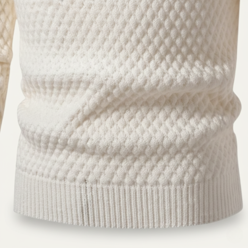 White thick wool knit turtleneck sweater close-up, textured stitch and ribbed hem