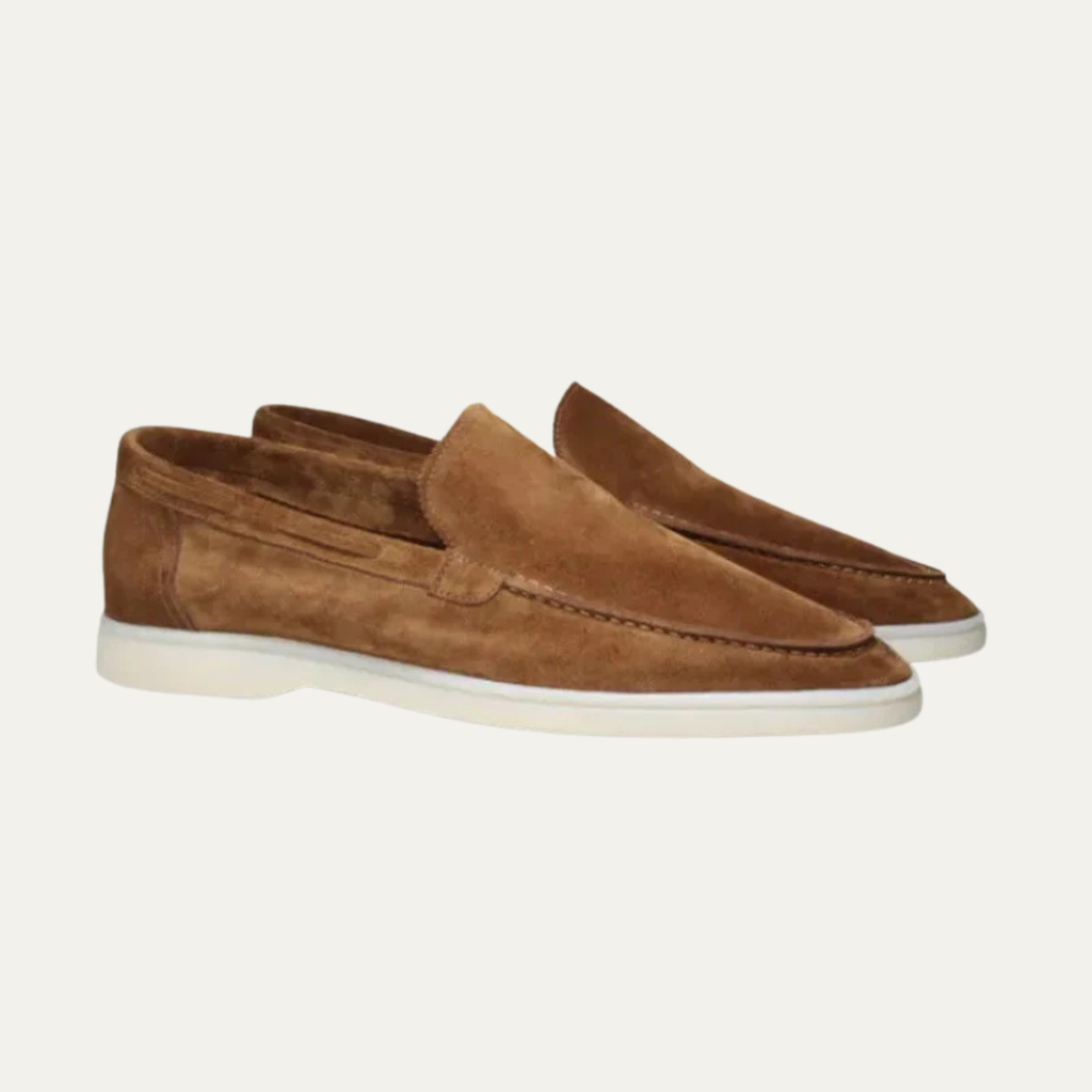Men's brown suede slip-on loafers with moc toe stitching and white rubber sole