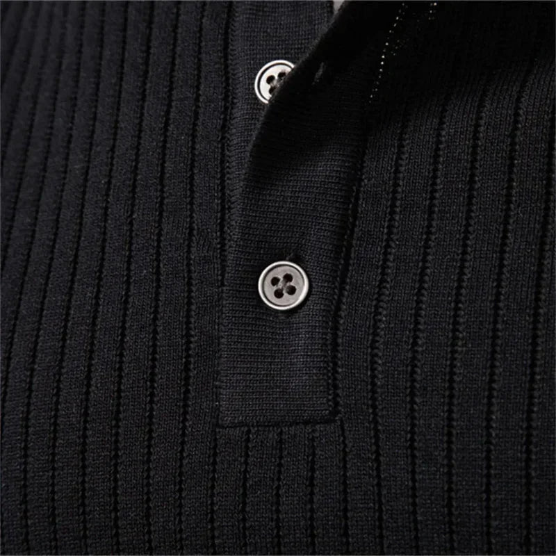 Black ribbed henley sweater close-up with round buttons on the neckline placket