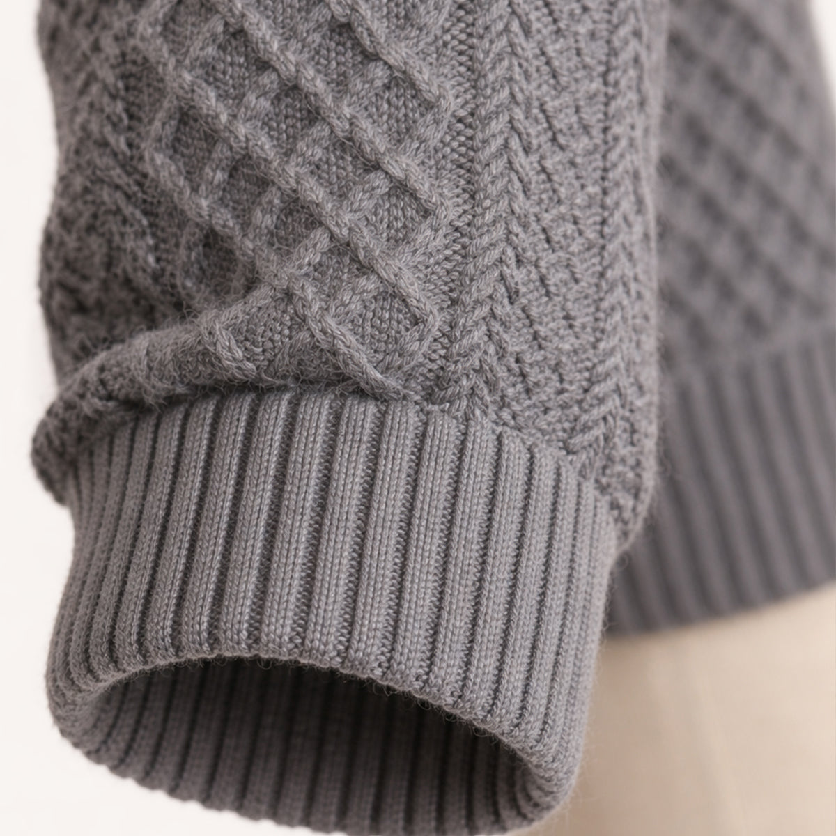 Dark gray ribbed knit cuff and textured body sweater