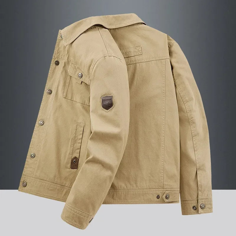Beige utility jacket with button front, long sleeves, and angled back pocket detail