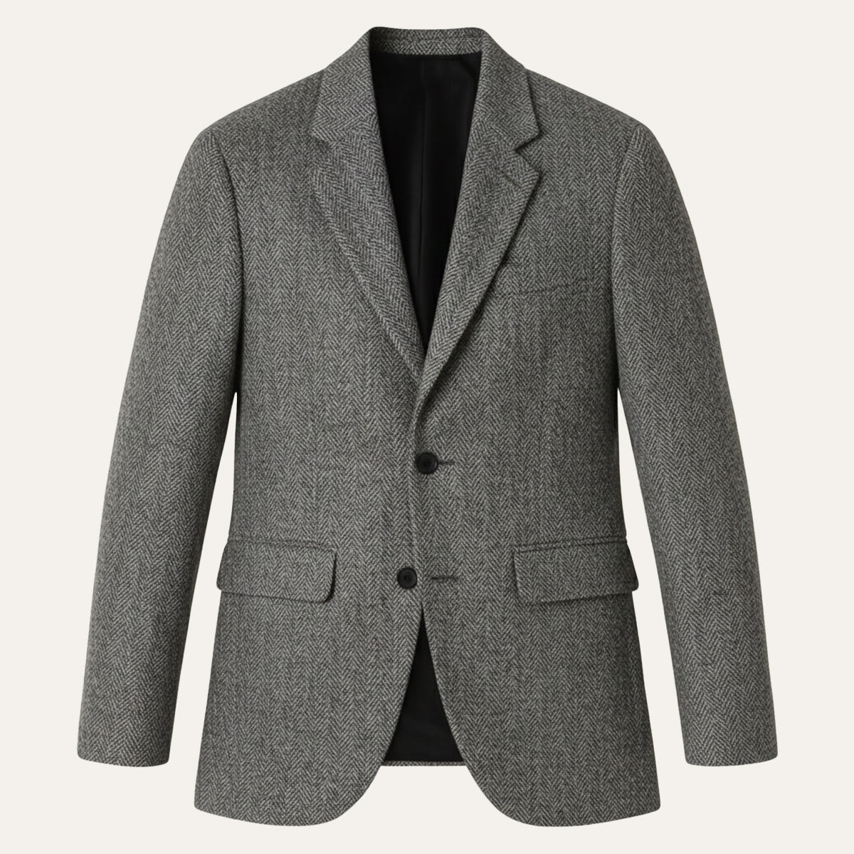 Gray herringbone tweed blazer with two-button front, notched lapels, and flap pockets.