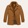 Men's brown long button-front jacket with stand collar, flap pockets, and ribbed cuffs