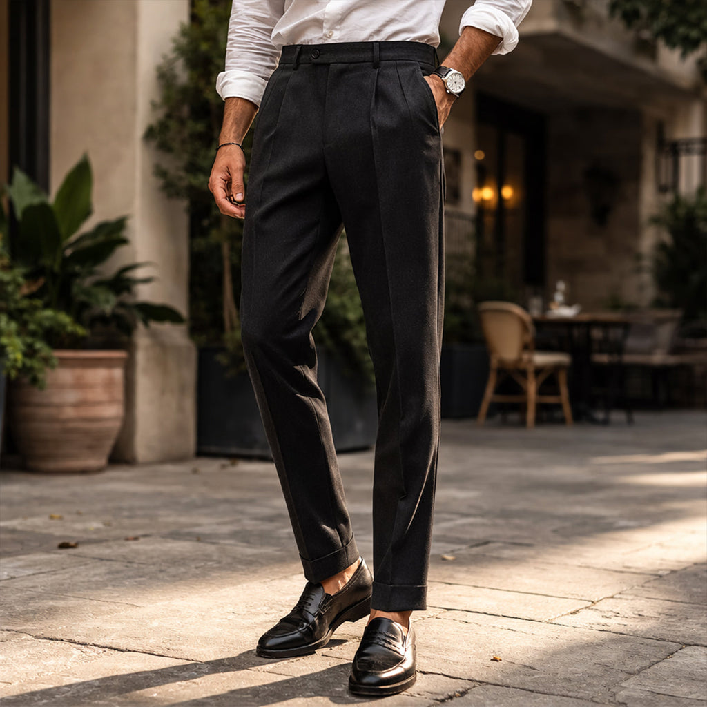 Men's black tailored pleated pants, flat front, belt loops, cuffed hems