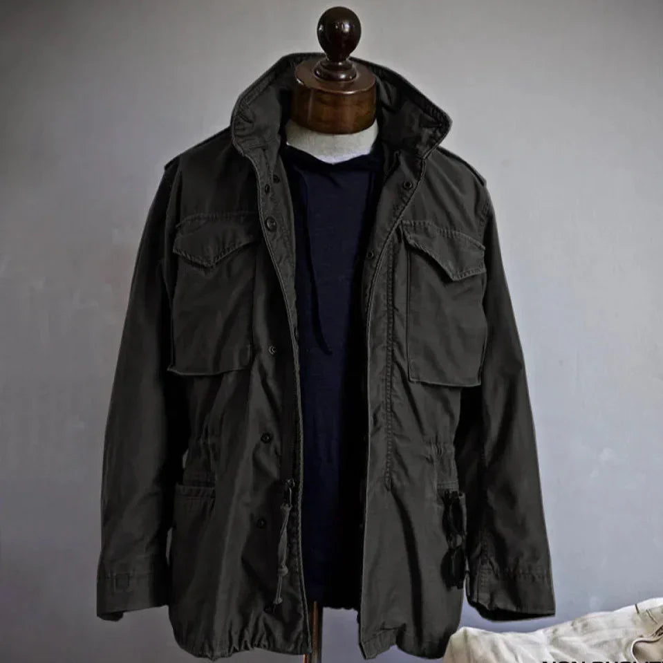 Black field jacket with flap pockets and button-front closure