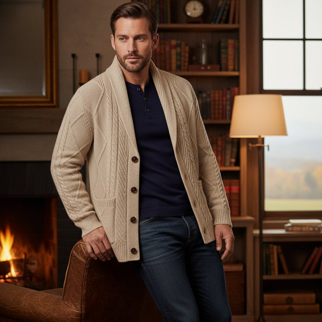 Men's beige wool button cardigan worn with dark jeans; shawl collar and button front