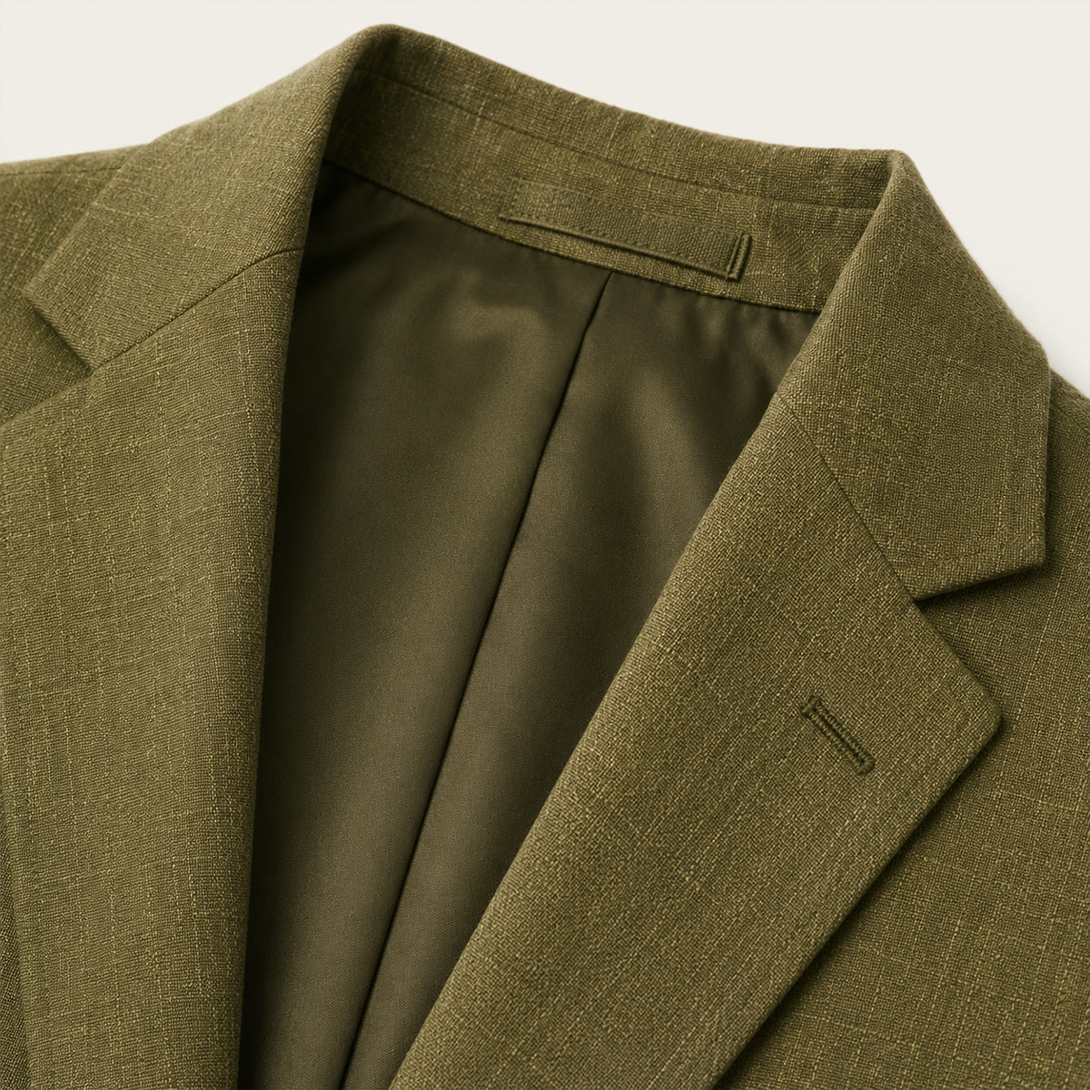 Olive green blazer with notched lapel and inner lining visible at collar