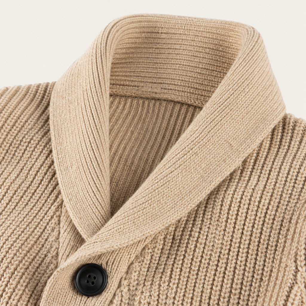 Khaki shawl-collar knit wool cardigan close-up, dark buttons and ribbed texture