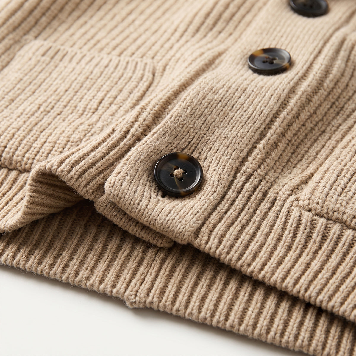 Khaki knit wool cardigan detail, black buttons and ribbed cuffs