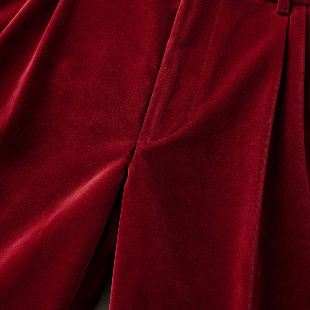 Burgundy velvet straight-fit pants close-up of front seam and side pocket