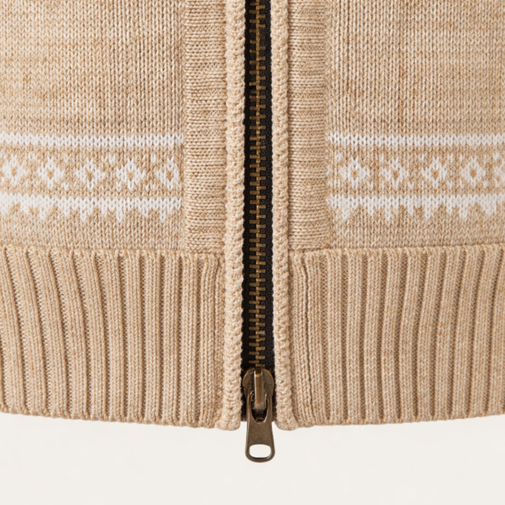 Beige knitted cardigan front close-up with metal zip and ribbed cuff details