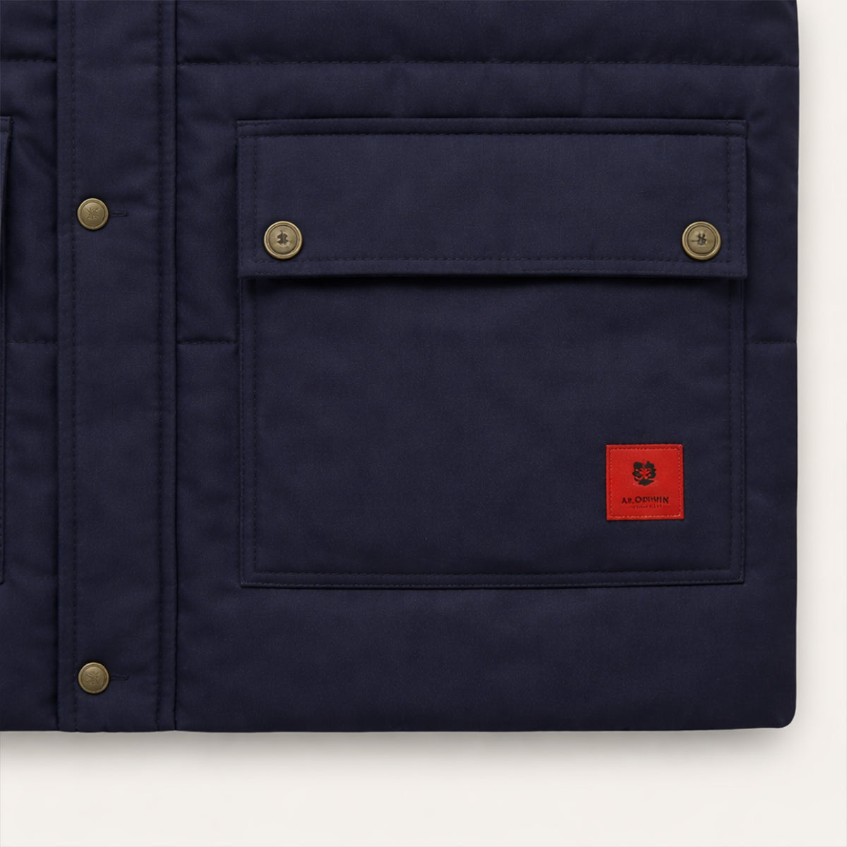 Men's navy fleece-lined vest with front chest pockets and logo patch on lower pocket