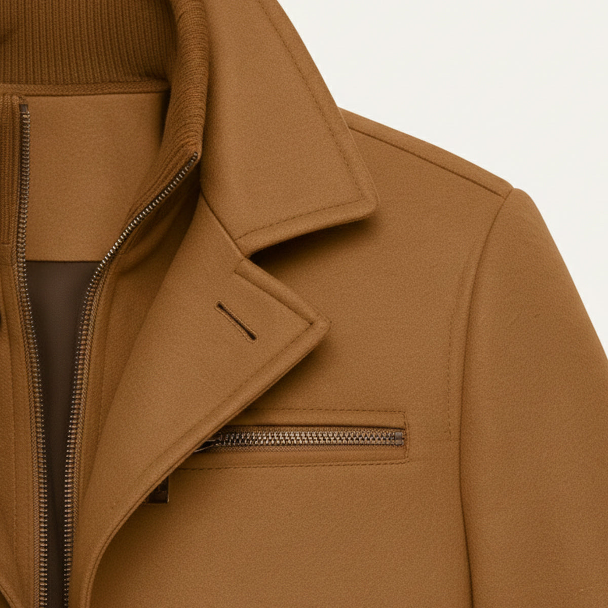 Men's brown jacket close-up of chest yoke, flap pocket, and hidden zip detail