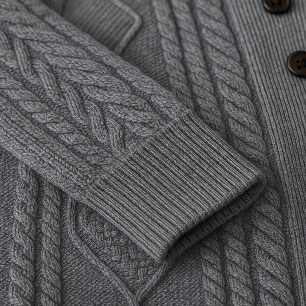 Gray cardigan fabric close-up with cable-knit braid and ribbed knit