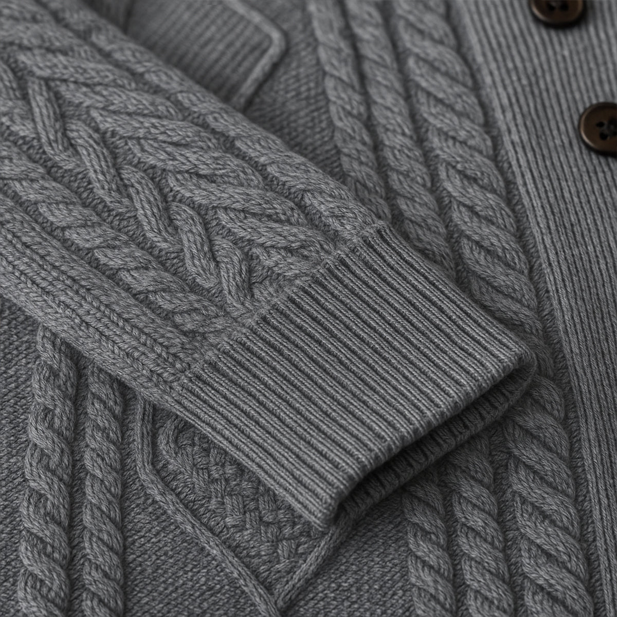 Gray cardigan fabric close-up with cable-knit braid and ribbed knit