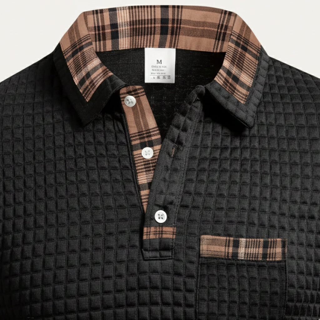 Men's black waffle-knit polo sweater with plaid collar, three-button placket, chest pocket