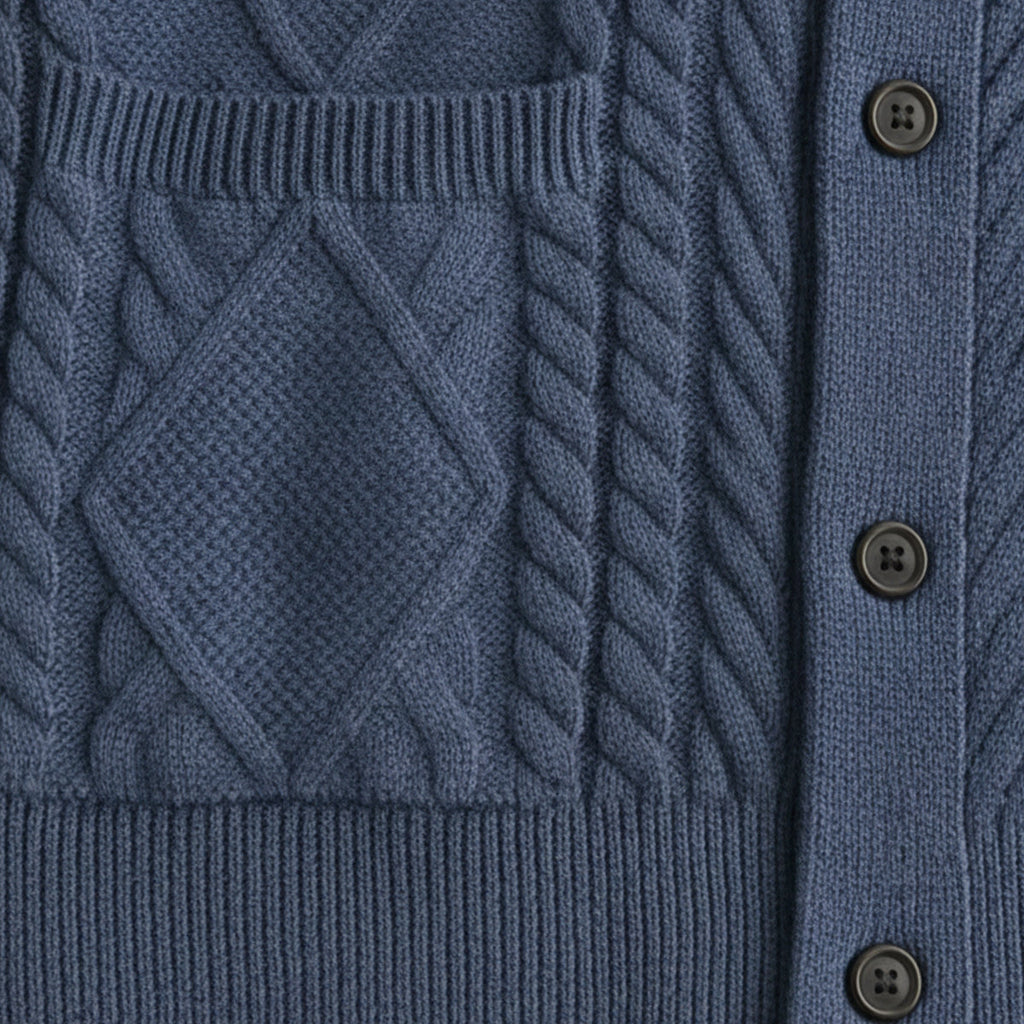Blue wool cardigan front with cable knit pattern, placket buttons, and pocket