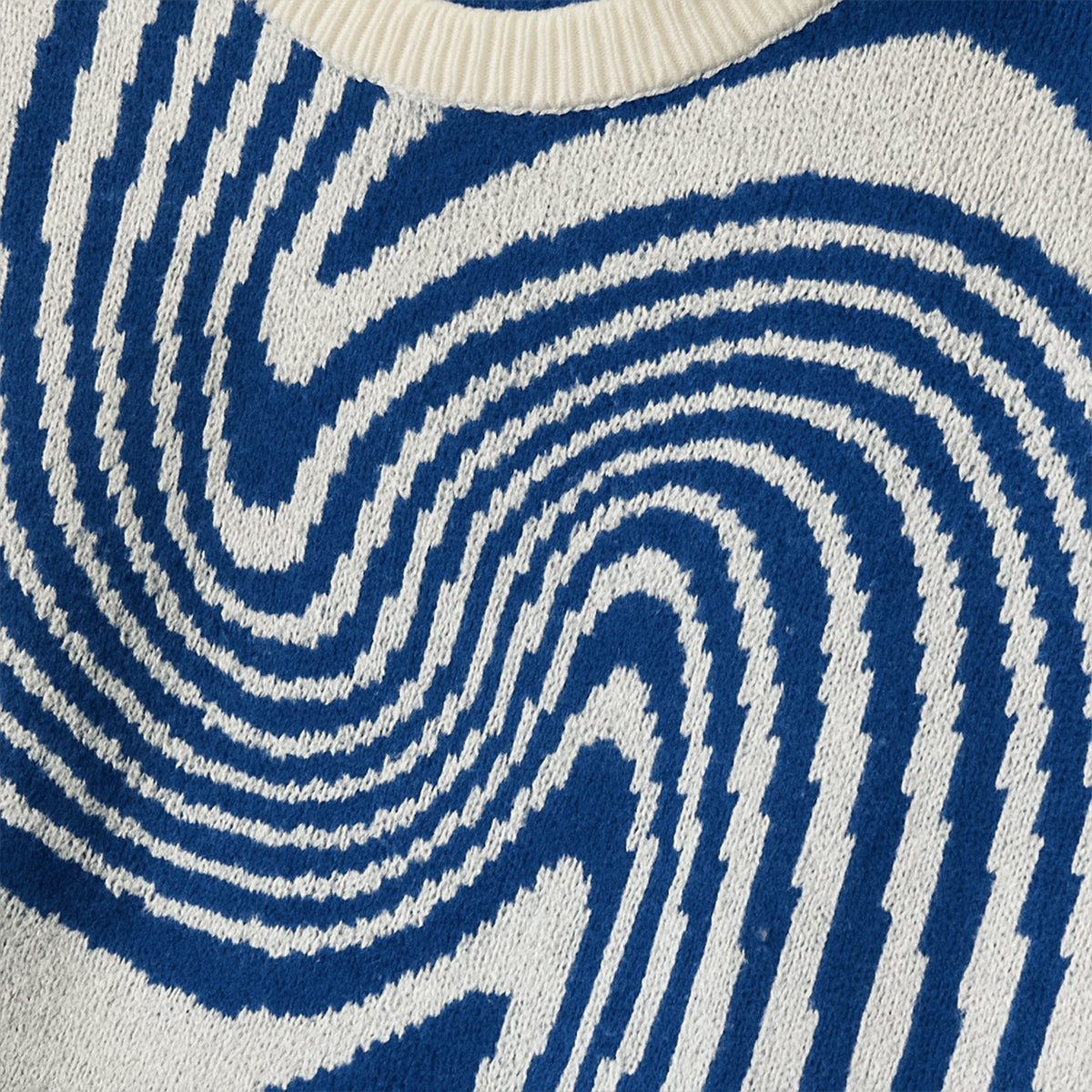 Blue-and-cream jacquard knit sweater fabric with concentric swirl stripe pattern