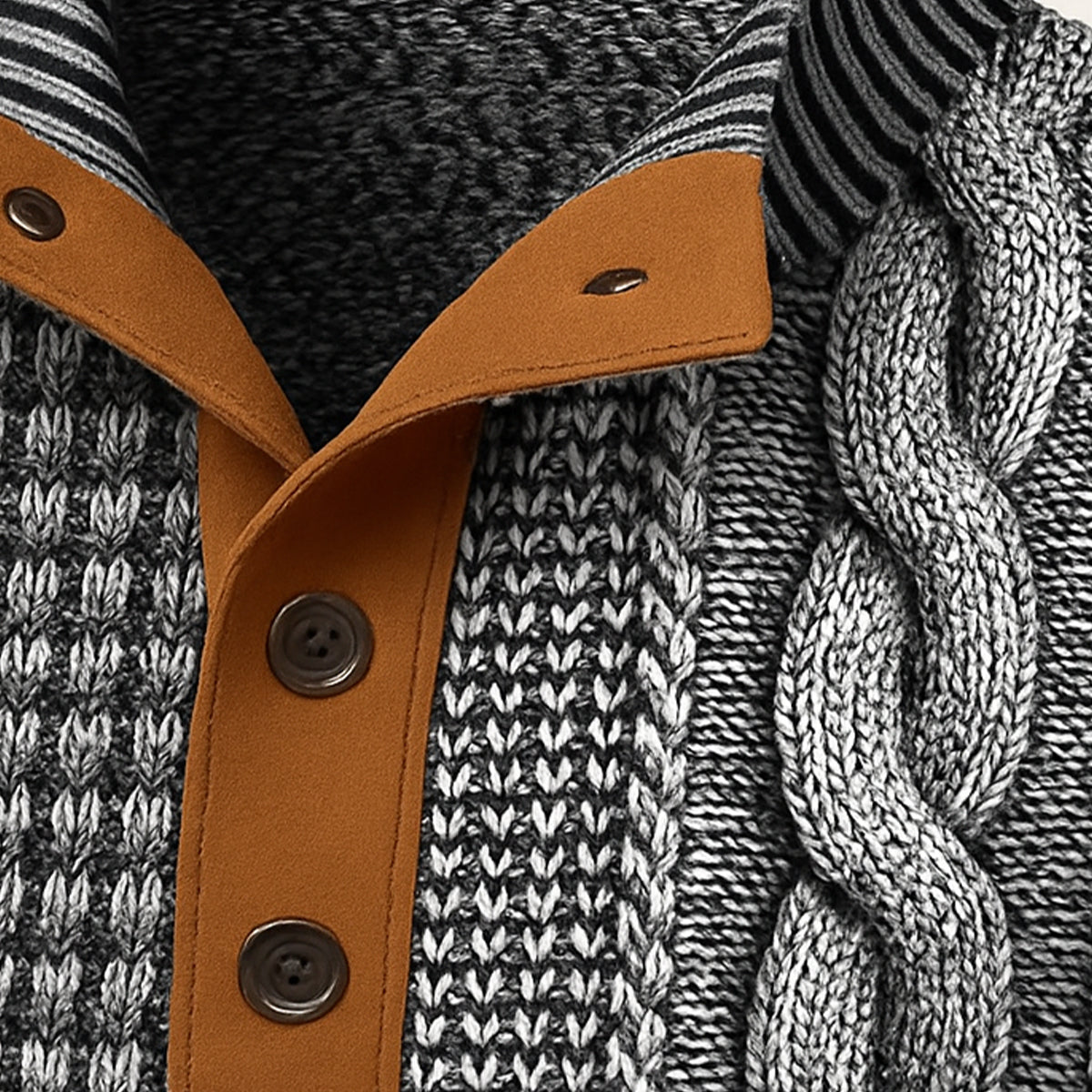 Close-up of knit sweater placket with brown leather-style trim and two button details