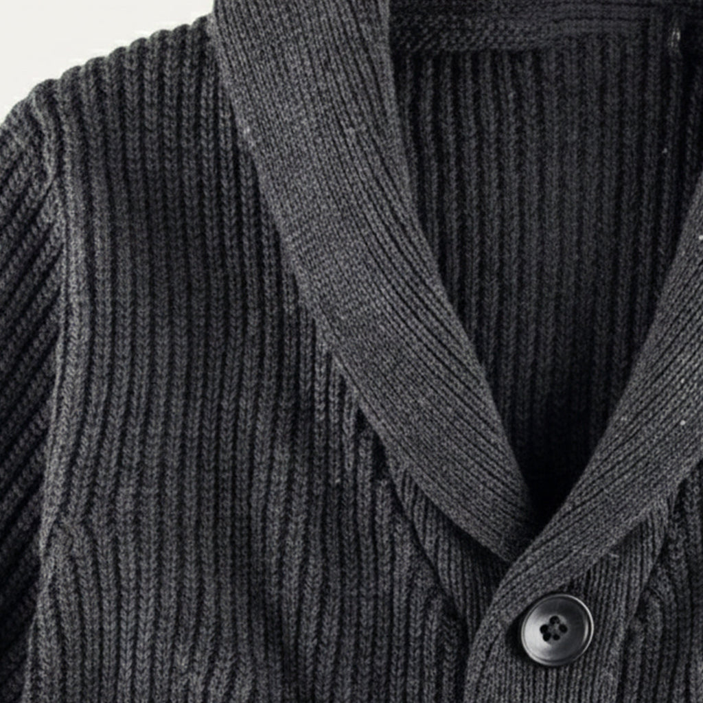 Dark gray chunky knit cardigan close-up with shawl collar and black buttons
