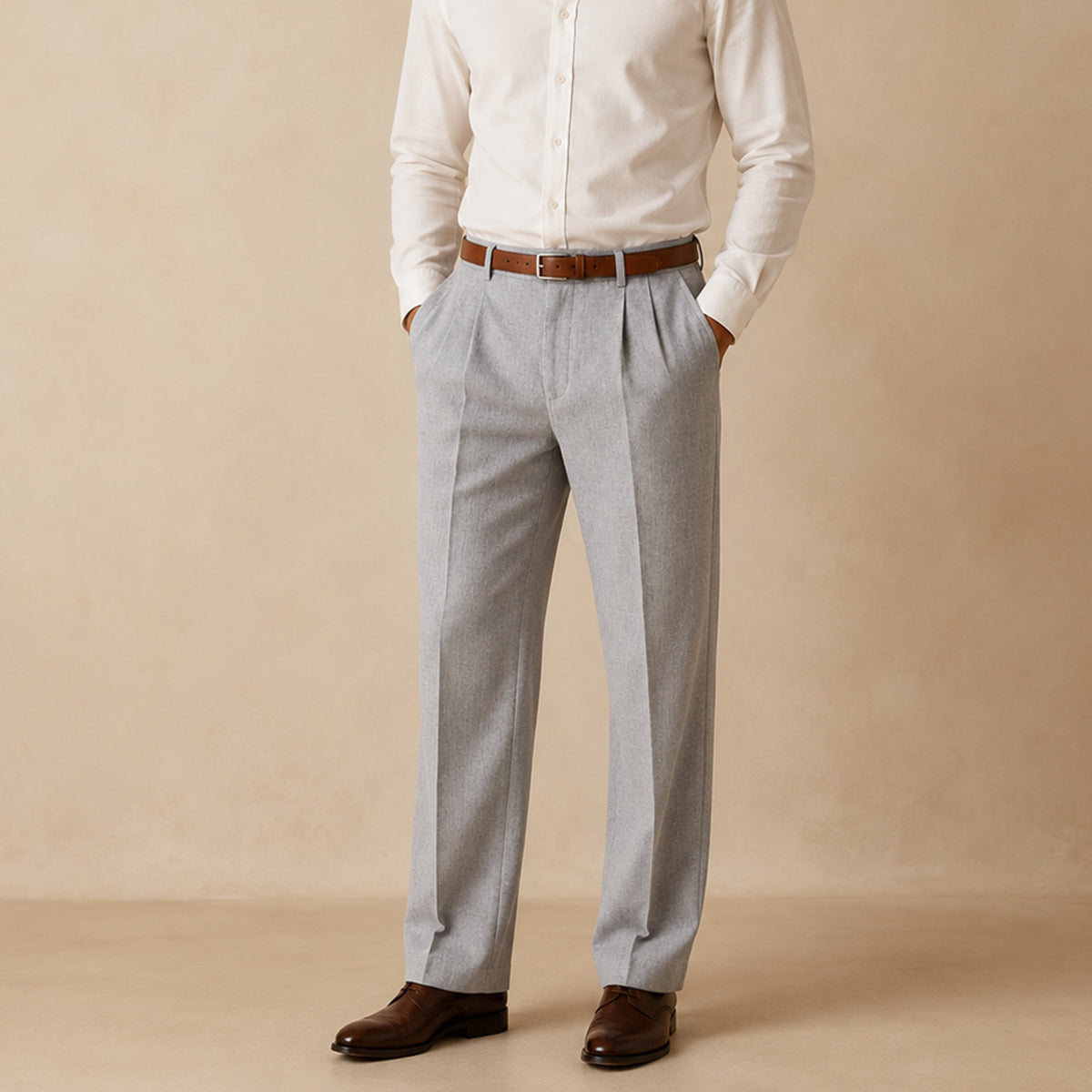 Men's light gray pleated straight pants worn with a brown belt and dark shoes