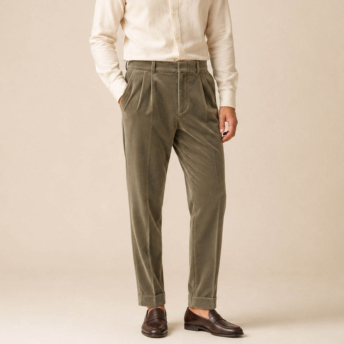 Men's olive velvet straight-fit pants on model with belt loops and tapered leg opening