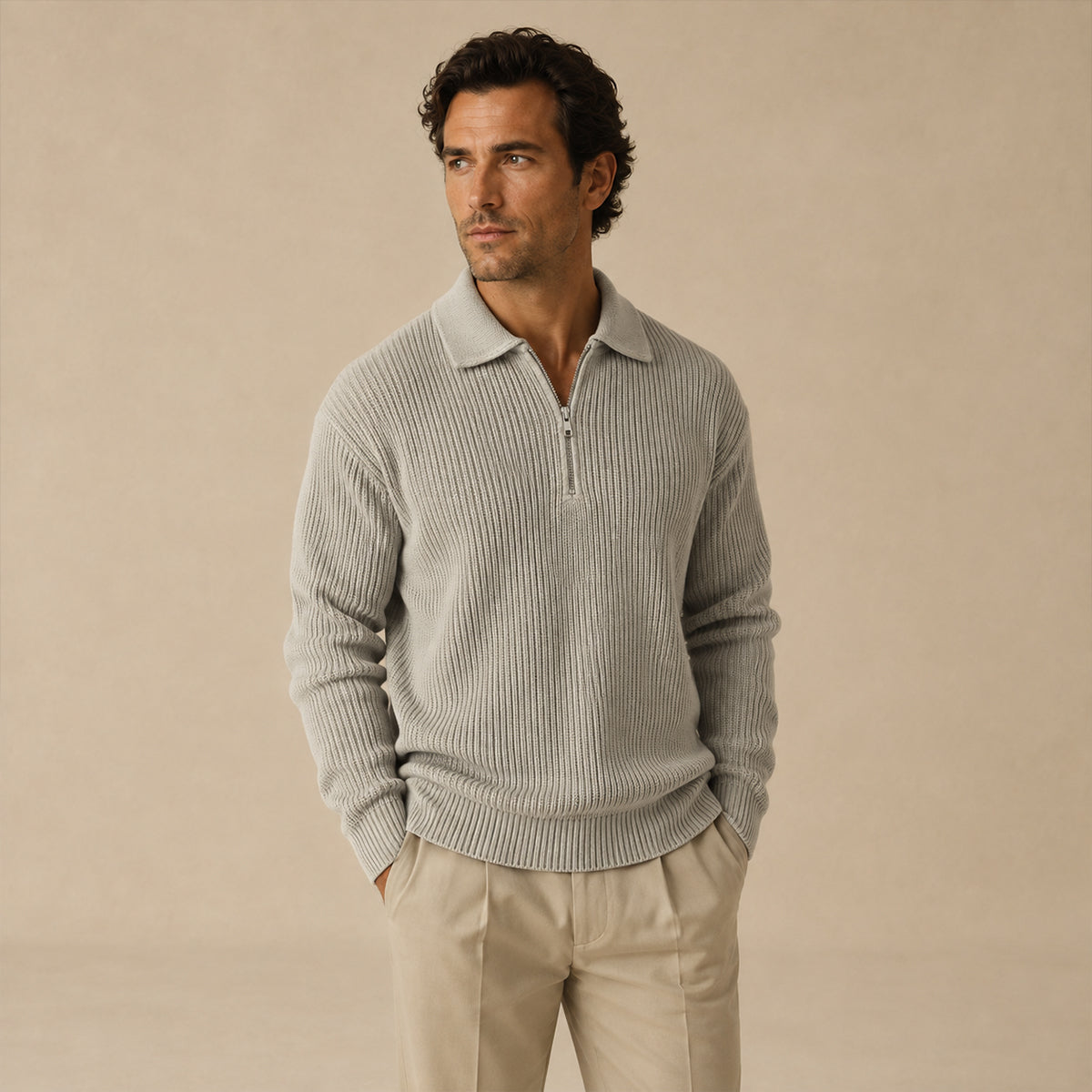 Men’s light gray half-zip ribbed knit sweater on model with long sleeves.