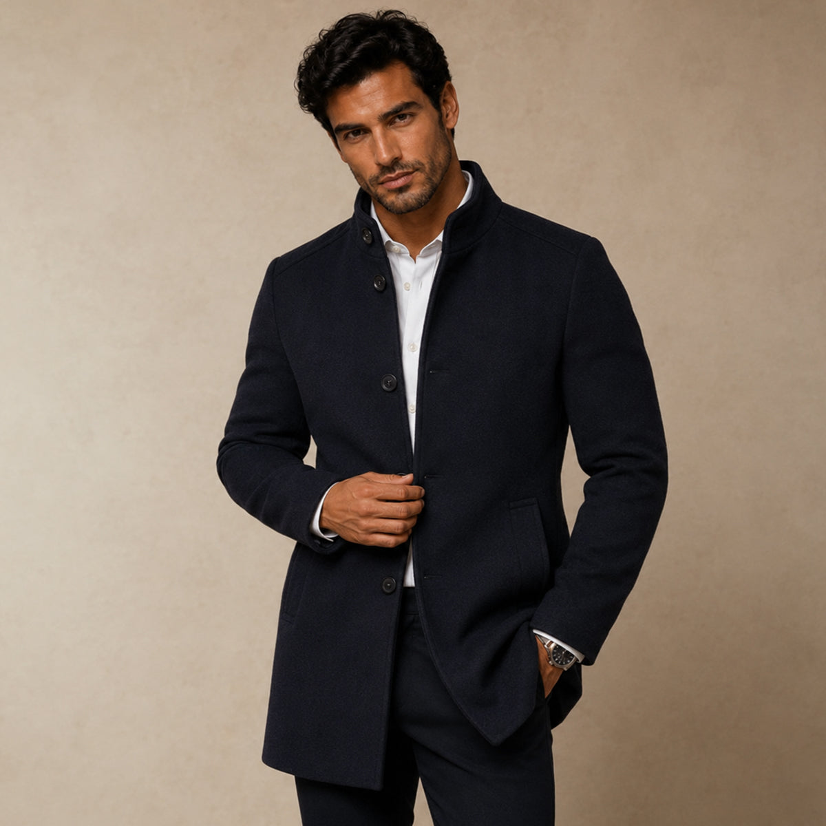 Dark wool overcoat worn on model, featuring button closure and side pocket detail.