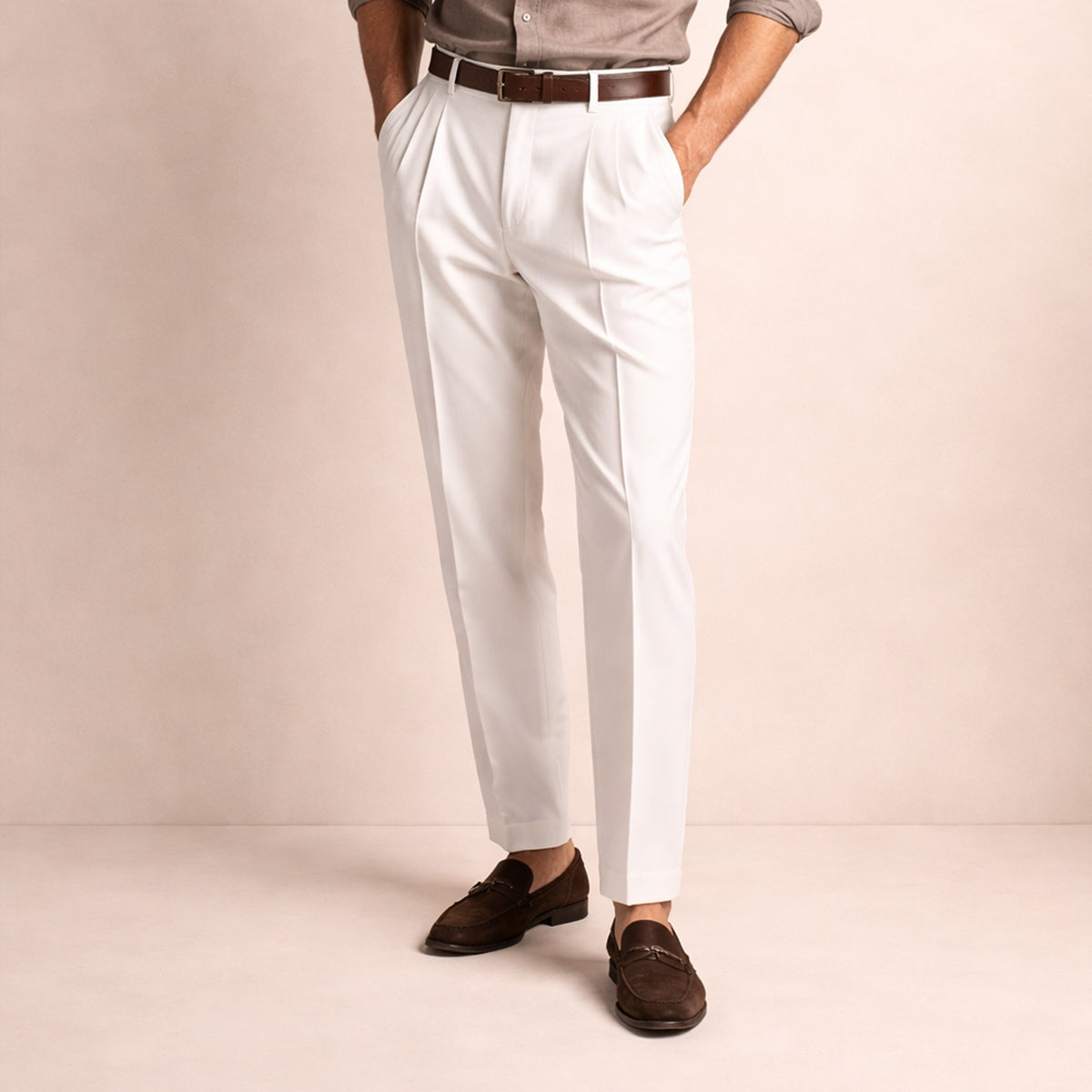 Men's white pleated trousers with crease front, belt loops, ankle length.