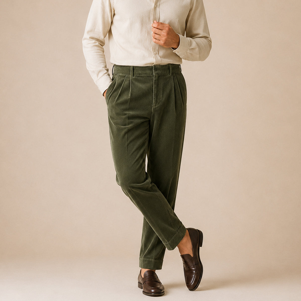 Men's army green velvet straight-fit pants on model with belt loops and front crease