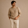 Men's beige cable knit winter sweater with ribbed hem, crew neck, and textured knit sleeves