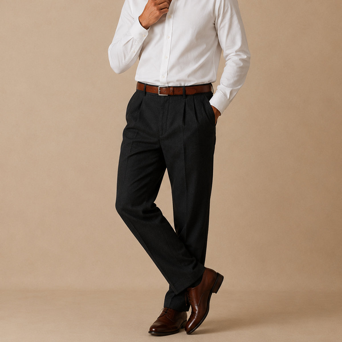 Men's black pleated straight pants worn with a brown belt and leather shoes