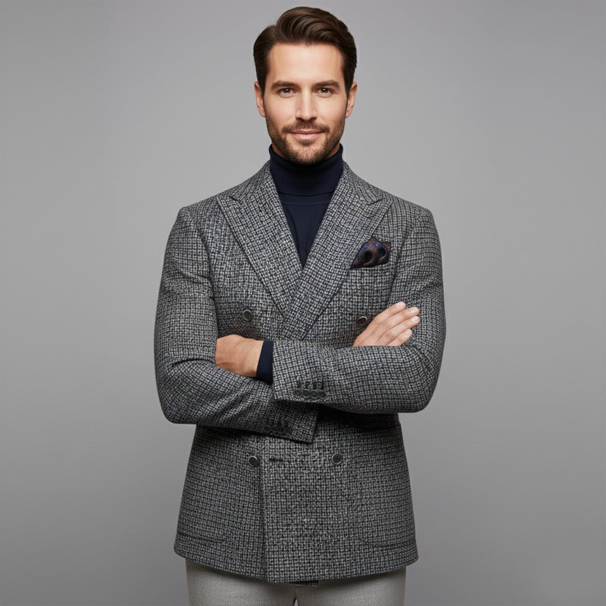 Men's gray textured double-breasted blazer with pocket square and buttoned front