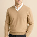 Men's beige wool V-neck sweater with ribbed hem and cuffs, layered over a white shirt