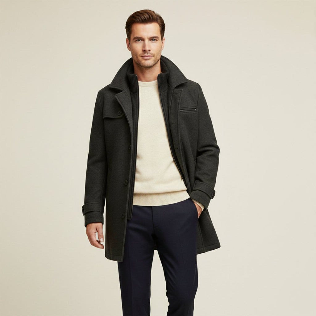 Men's dark long jacket worn with open front, showing stand collar and button closures