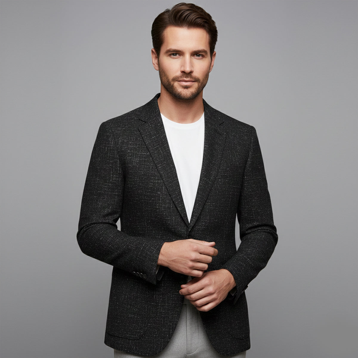 Men's black textured double-breasted blazer with notched lapels and front buttons