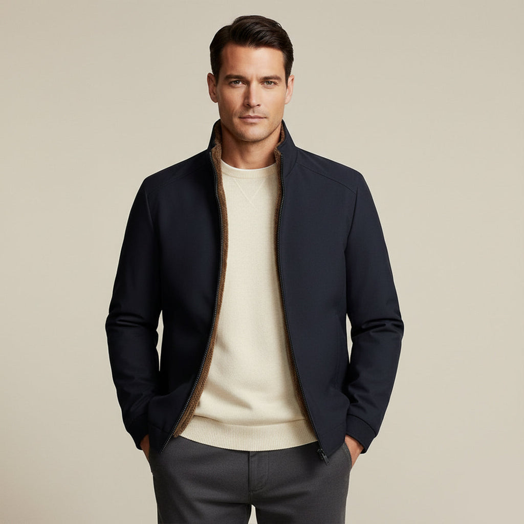 Men’s dark blue winter jacket with zipper front, open fleece lining, and ribbed cuffs.