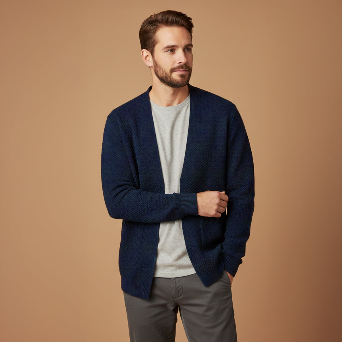 Men's navy blue open-front knit cardigan with patch pockets and ribbed cuffs