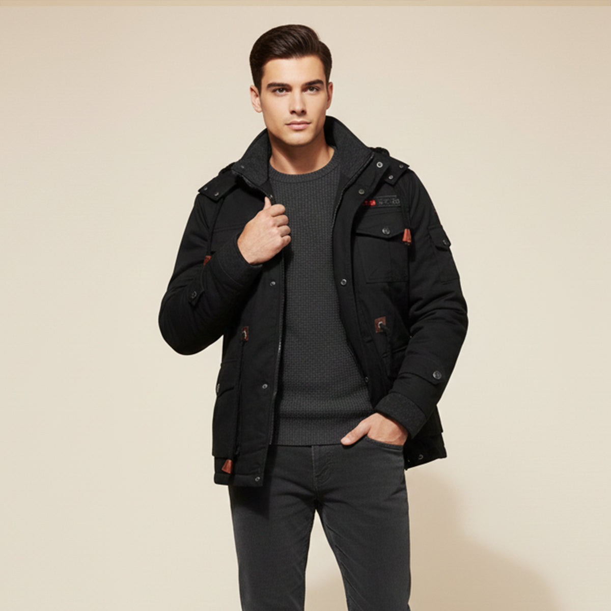 Men's black hooded jacket with plush lining, snap flaps on pockets, and zip front